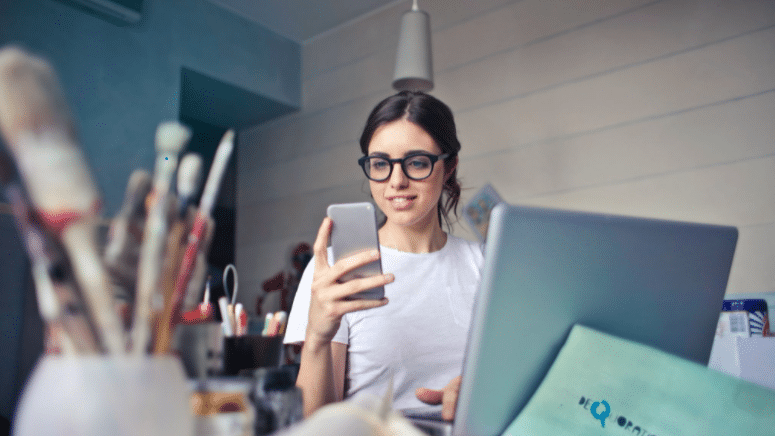 Woman wearing glasses on laptop